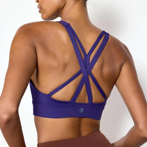 Back view of a purple pull over sports bra, showing the trendy 4 straps crisscrossed across the back