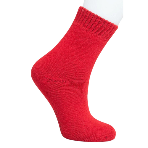 Red wool sock on foot 